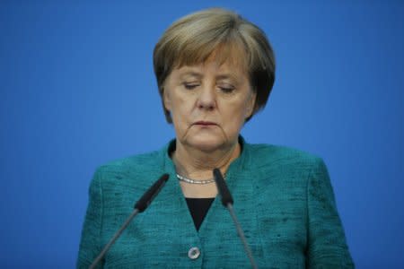 Christian Democratic Union (CDU) leader and German Chancellor Angela Merkel gives a statement  in Berlin, Germany, February 7, 2018. REUTERS/Axel Schmidt