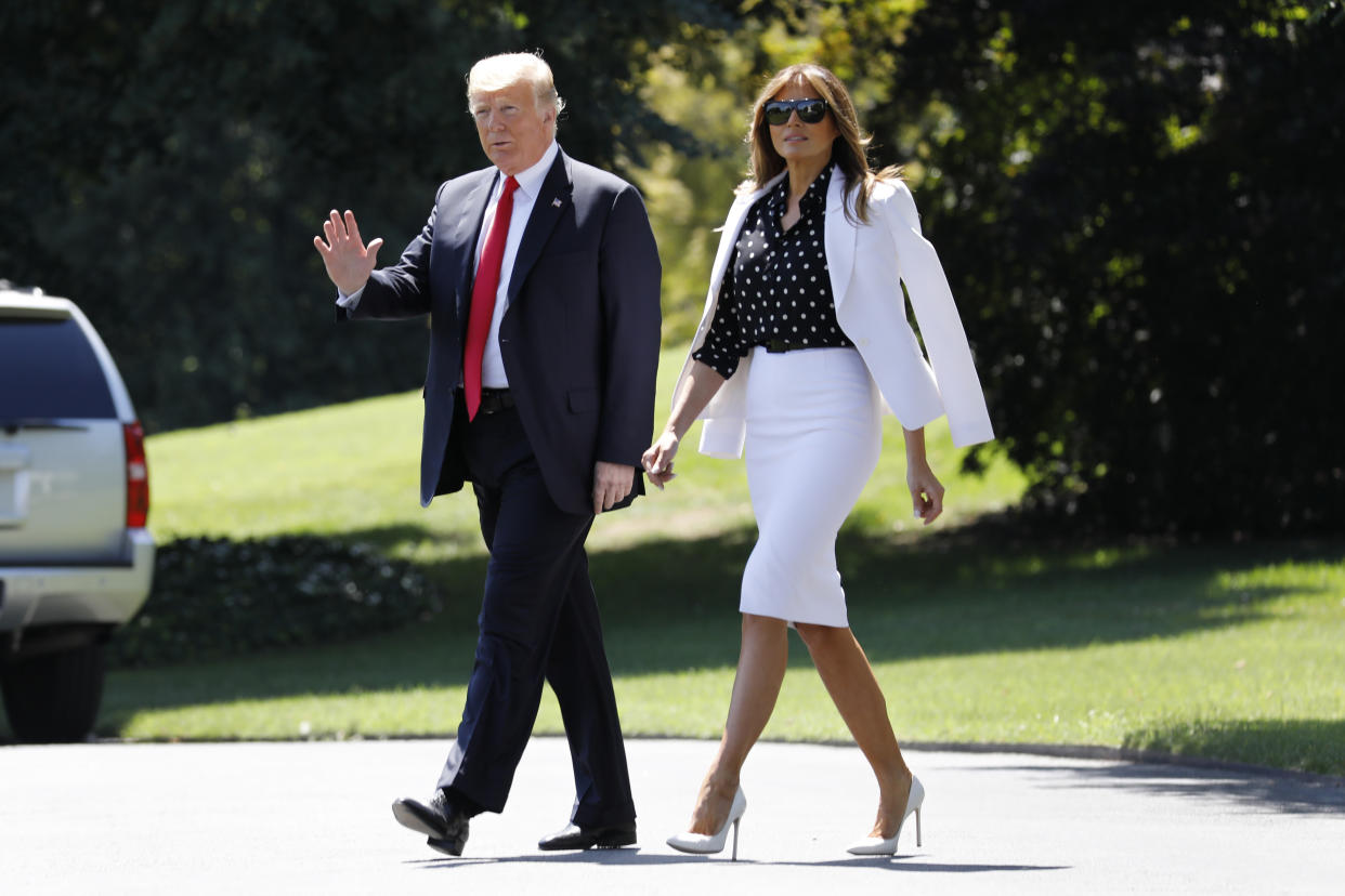 Melania Trump, pictured with President Trump, wore classic white for a trip to Ohio. (Photo: Getty Images)