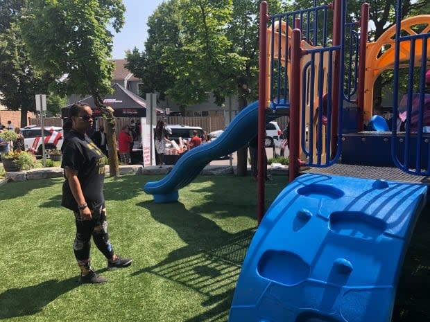 Stacey King looks at the revitalized playground where her two daughters were shot three years ago.   (Dale Manucdoc/CBC - image credit)