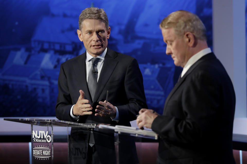 Democratic candidate Tom Malinowski, left, looks toward Republican candidate Leonard Lance while answer a question during a U.S. Congressional District 7 debate, Wednesday, Oct. 17, 2018, in Newark, N.J. (AP Photo/Julio Cortez)