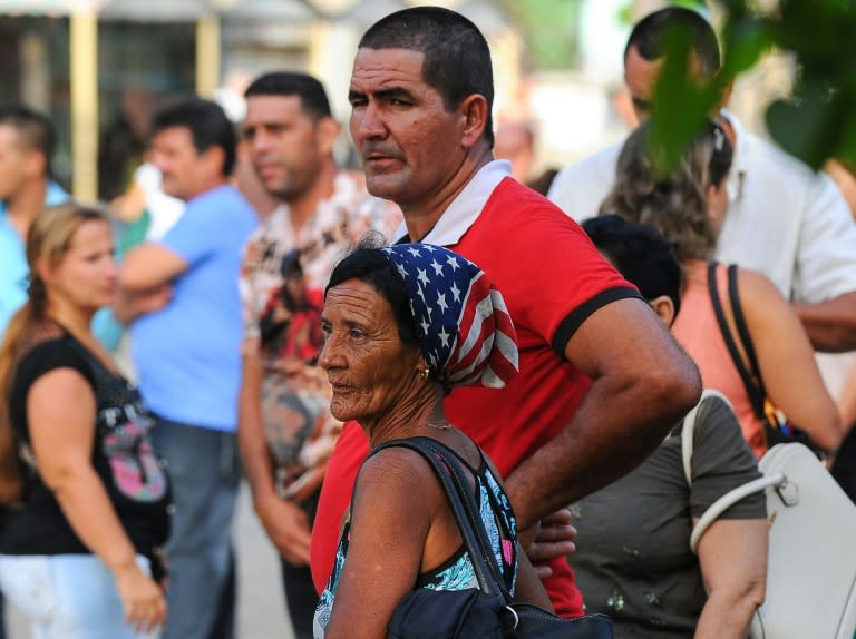 Cubans congregate in a square outside the US interests section in Havana to apply for visas, on July 1, 2015