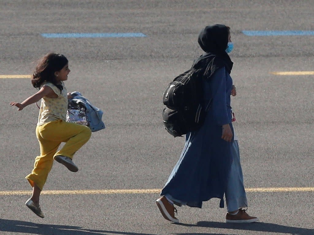 The picture of the girl was taken by Reuters photographer Johanna Geron at a military airport near Brussels earlier this week  (REUTERS)