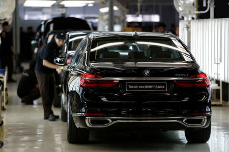 A worker polishes a locally assembled new BMW 7 Series at a Gaya Motor assembly plant in Jakarta, Indonesia November 30, 2016. REUTERS/Darren Whiteside
