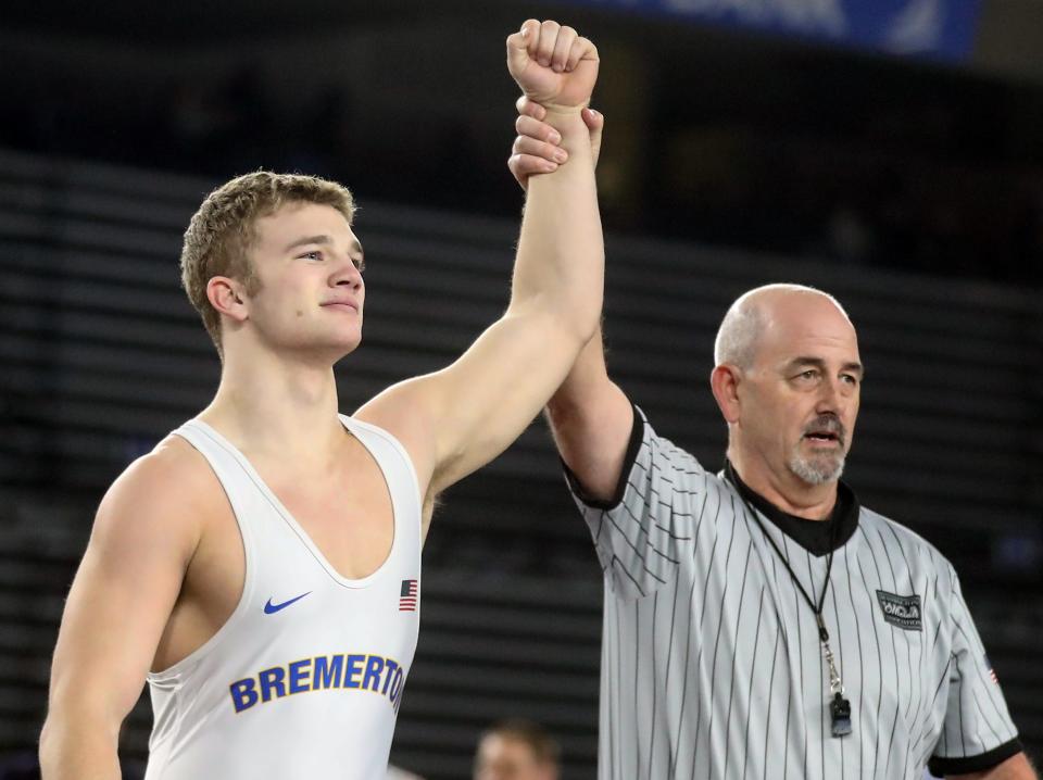 Bremerton’s Lars Michaelson takes first place over Prosser’s Nehemiah Medrona in their 182-pound championship bout during Mat Classic Championships at the Tacoma Dome on Saturday, Feb. 18, 2023. 