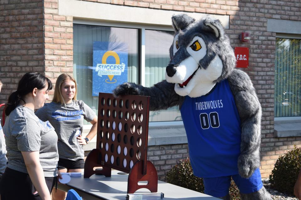 The NCMC Timberwolf plays a game of Connect 4 at the 2023 Timberwolves Athletic Rally on Sept. 23, 2023.