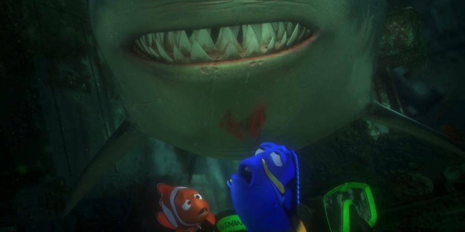 A still from "Finding Nemo" shows blue fish Dory holding her nose as blood seeps upwards, next to her is orange and white clownfish Marlin, and in the background is shark Bruce.