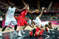 Ike Diogu #6 of Nigeria crashes into Salah Mejri #15 of Tunisia during their Men's Basketball game on Day 2 of the London 2012 Olympic Games at the Basketball Arena on July 29, 2012 in London, England. (Photo by Christian Petersen/Getty Images)