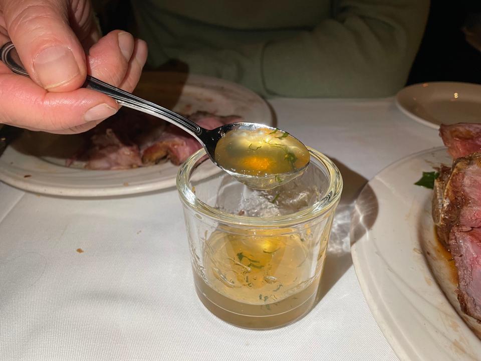 Mint Jelly in spoon being taken out of glass