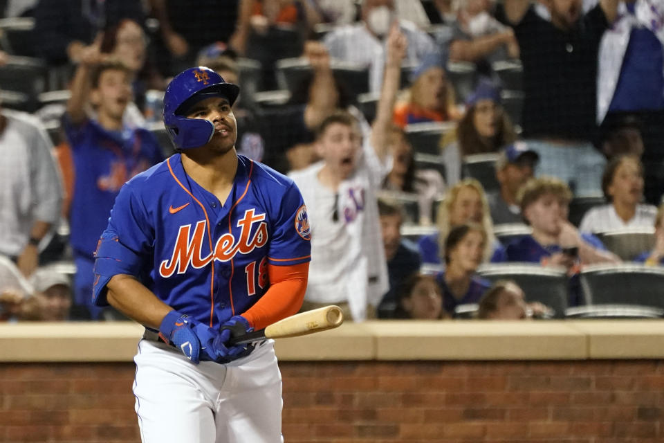 New York Mets' Nick Plummer watches the ball after hitting the game-tying home run for his first major league hit during the ninth inning of a baseball game against the Philadelphia Phillies, Sunday, May 29, 2022, in New York. (AP Photo/Mary Altaffer)