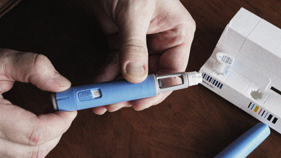 A person prepares a semaglutide  injection (myskin / Shutterstock)
