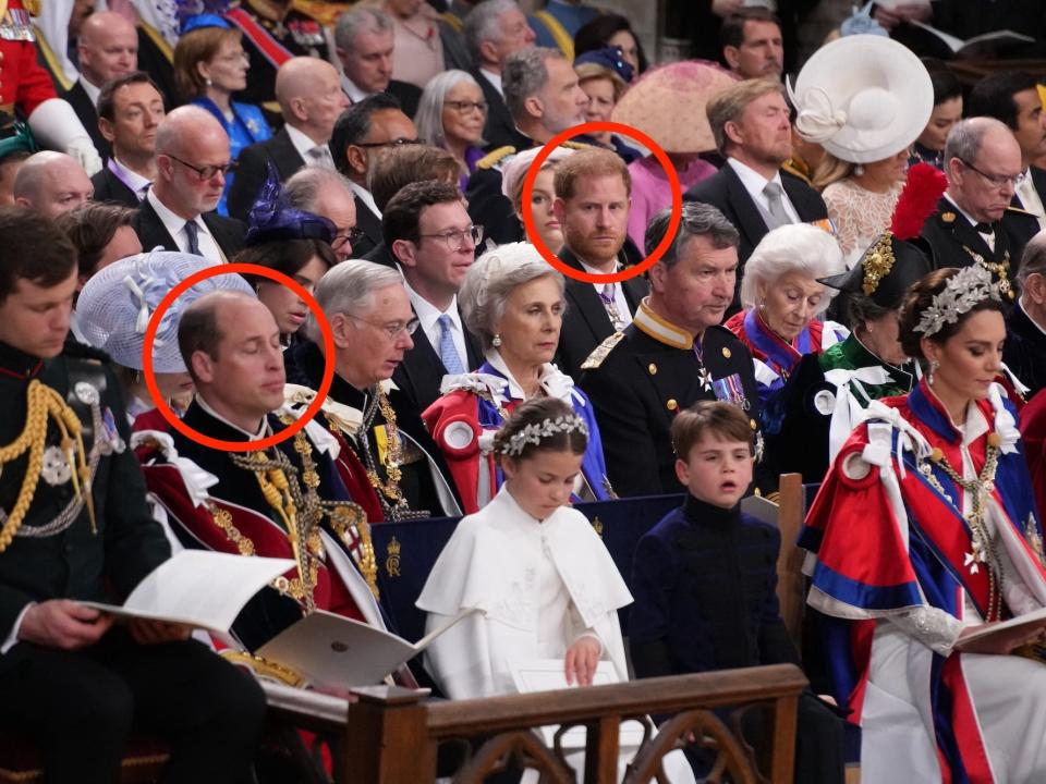 Prince Harry looks towards Prince William at King Charles III's coronation.