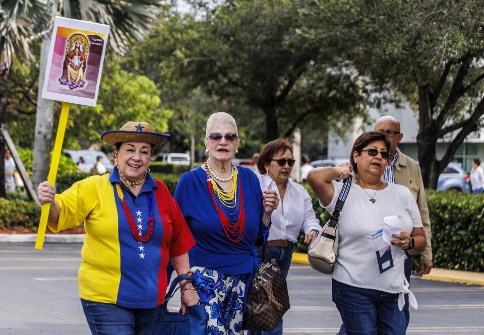 Maritza Urrutia, Margot Perez Mena and Ana Maria Leon were among the thousands of exiled Venezuelans participating in the primaries elections to choose the opposition's candidate for next year's presidential election in Doral, Fla., on Sunday, Oct. 22, 2023. (Pedro Portal/Miami Herald via AP)
