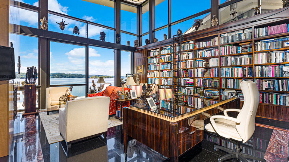 The library, which features towering glass walls - Credit: Walker Esner