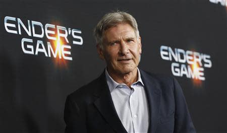 Cast member Harrison Ford poses at the premiere of "Ender's Game" at the TCL Chinese theatre in Hollywood, California October 28, 2013. REUTERS/Mario Anzuoni