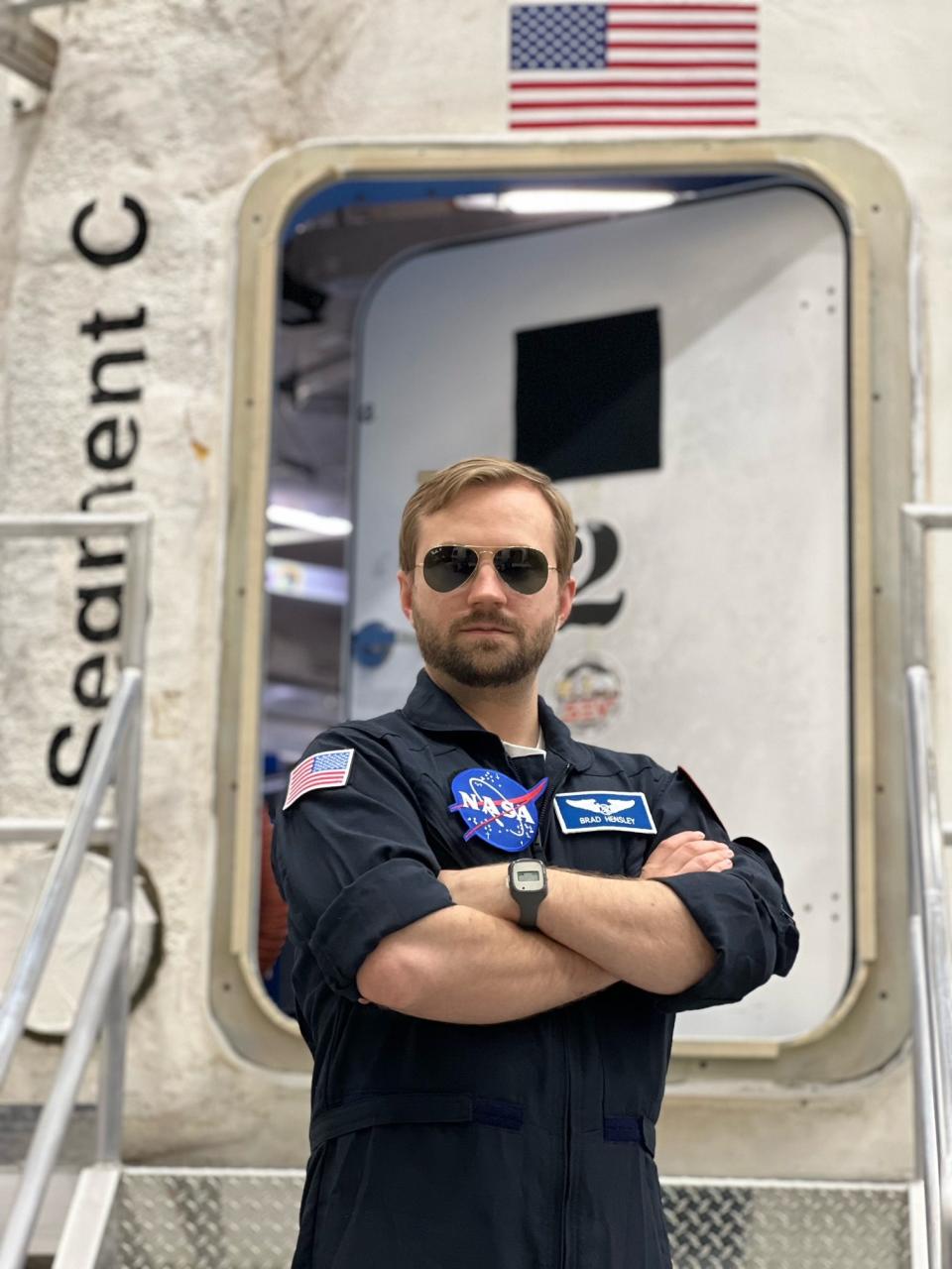 Oak Ridge resident Bradley Hensley stands ready in his NASA flight suit. He recently embarked on a mission that will simulate a long space voyage to one of Mars's moons.