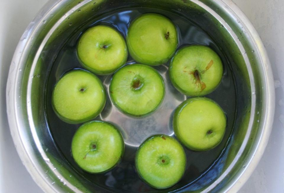Apples boiling in hot water.