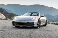 <p>With transcendent driving traits and terrific twin-turbo flat-six engines, the 2022 Porsche 911 is a nearly flawless sports car, and it's an obvious <a href="https://www.caranddriver.com/features/a38873223/2022-editors-choice/" rel="nofollow noopener" target="_blank" data-ylk="slk:Editors' Choice winner;elm:context_link;itc:0;sec:content-canvas" class="link ">Editors' Choice winner</a>. Apart from being too expensive for most enthusiasts, <a href="https://www.caranddriver.com/porsche" rel="nofollow noopener" target="_blank" data-ylk="slk:Porsche's;elm:context_link;itc:0;sec:content-canvas" class="link ">Porsche's</a> iconic two-plus-two-seater is as immersive as it is versatile. Along with the aforementioned flat-six which produces a distinctive snarl and makes between 379 and 473 horsepower­­–we review the higher-powered <a href="https://www.caranddriver.com/porsche/911-gt3-gt3-rs" rel="nofollow noopener" target="_blank" data-ylk="slk:GT3;elm:context_link;itc:0;sec:content-canvas" class="link ">GT3</a> and <a href="https://www.caranddriver.com/porsche/911-turbo-turbo-s" rel="nofollow noopener" target="_blank" data-ylk="slk:Turbo;elm:context_link;itc:0;sec:content-canvas" class="link ">Turbo</a> variants separately­–the lineup offers a quick-shifting dual-clutch automatic or manual transmission and rear- or all-wheel drive. The latter ensures its incredible performance can be enjoyed in all four seasons. The 911 comes in coupe, cabriolet (read: convertible), or quasi-convertible Targa body styles. The beauty of the 911 is that its athleticism doesn't diminish its livability. Its ride is surprisingly civil considering its cornering limits and race car-like steering feel. Its interior is roomy up front and can be lavishly appointed. And its driver is treated to a satisfyingly low seating position but also excellent outward visibility.<br></p><p><a class="link " href="https://www.caranddriver.com/porsche/911" rel="nofollow noopener" target="_blank" data-ylk="slk:Review, Pricing, and Specs;elm:context_link;itc:0;sec:content-canvas">Review, Pricing, and Specs</a></p>