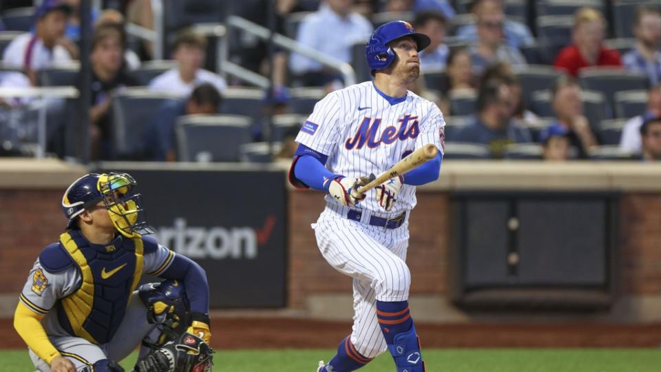 Jun 27, 2023; New York City, New York, USA; New York Mets center fielder Brandon Nimmo (9) hits a solo home run during the fourth inning in front Milwaukee Brewers catcher William Contreras (24) at Citi Field.