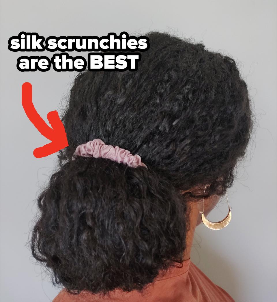 arrow pointing to a scrunchie holding hair back