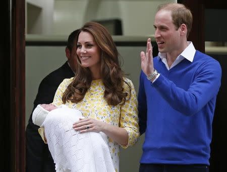 Britain's Prince William and his wife Catherine, Duchess of Cambridge, appear with their baby daughter outside the Lindo Wing of St Mary's Hospital, in London, Britain May 2, 2015. The Duchess of Cambridge, gave birth to a girl on Saturday, the couple's second child and a sister to one-year-old Prince George. REUTERS/Suzanne Plunkett