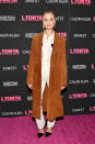 <p>The actress wore a white lace jumpsuit with a cognac suede coat for the premiere of her new movie. (Photo: Getty Images) </p>