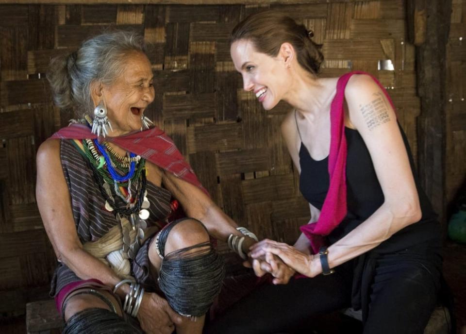UNHCR Special Envoy Angelina Jolie meets Baw Meh, an ethnic Karenni refugee from Myanmar, in Ban Mai Nai Soi refugee camp, Thailand, in June 2014 (UNHCR/Roger Arnold)