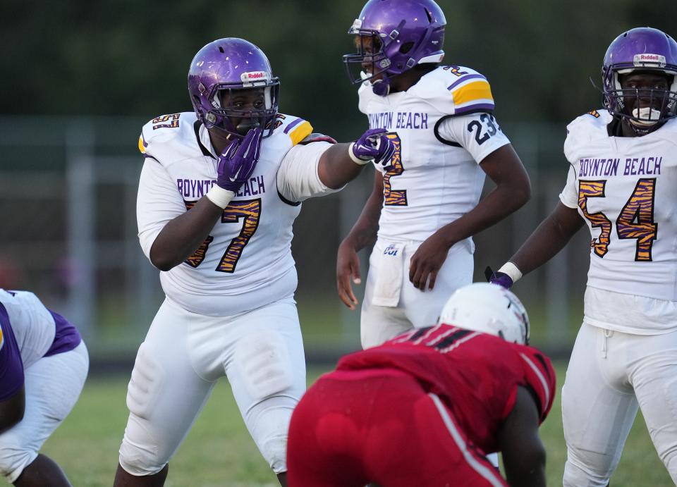 Boynton Beach’s Edwin Jean (57) alerts his teammates during the game against Santaluces during the first half on Friday, September 2, 2022 in Lantana.