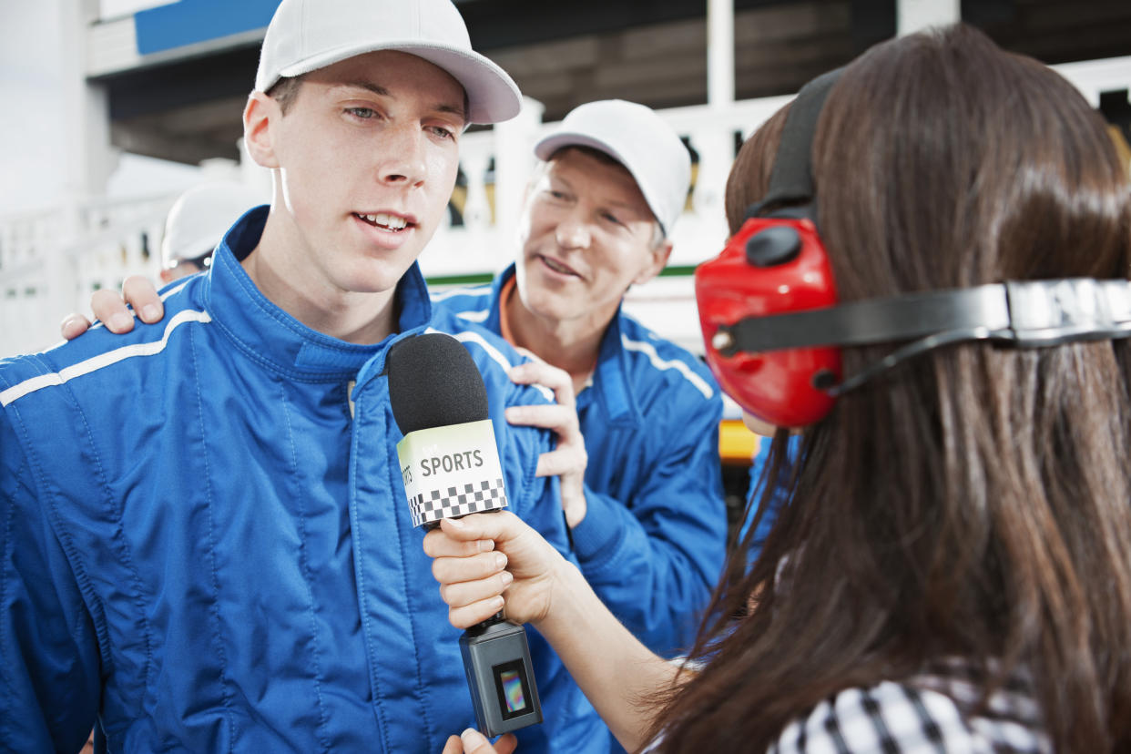 Race car driver talking to microphone