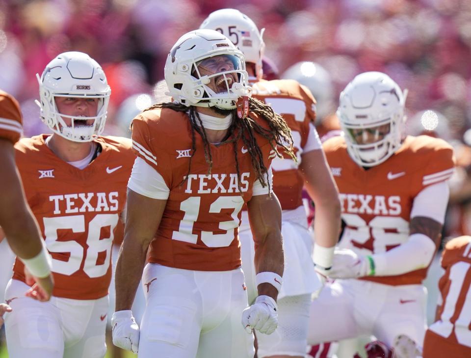 Texas wide receiver Jordan Whittington celebrates a first-down catch against Oklahoma during the Sooners' 34-30 win Oct. 7. The Longhorns' final six games are against lower-rated teams, and that could be a positive or negative in the eyes of the CFP selection committee.