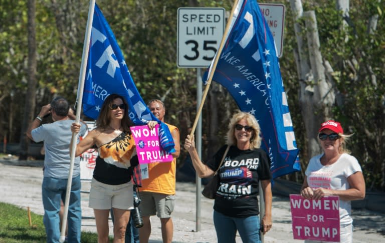 Supporters of US President Donald Trump are seen near his Mar-a-Lago estate in Palm Beach, Florida on March 18, 2017