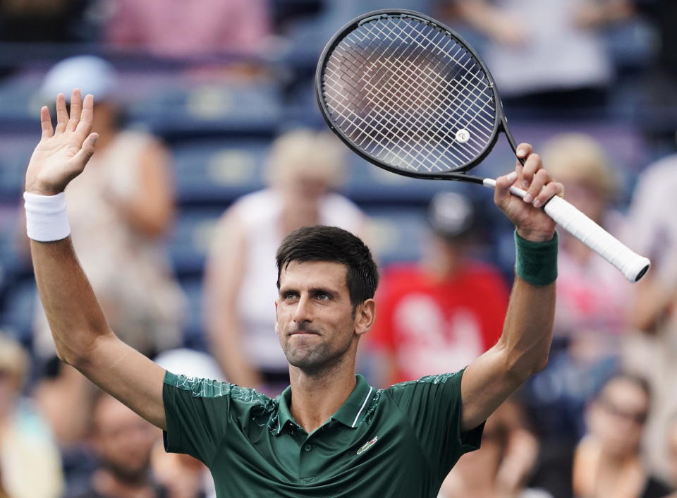 Novak Djokovic, of Serbia, celebrates defeating Peter Polansky, of Canada, at the Rogers Cup men's tennis tournament in Toronto, Wednesday, Aug. 8, 2018. (Mark Blinch/The Canadian Press via AP)