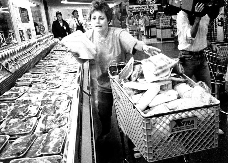 In 1987, Barbara Dixon went on a five-minute shopping spree at the Xtra store at 441 and Oakland Park Boulevard in Broward. Here she is filling her second cart at the meat case. She came away with over $1,600 in food.