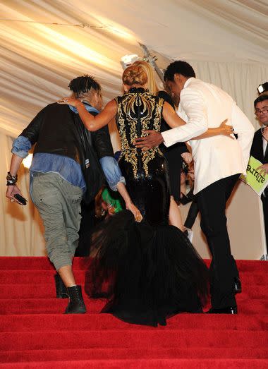 Beyonce getting assistance to climb the stairs at the Met Gala. Credit: Getty Images