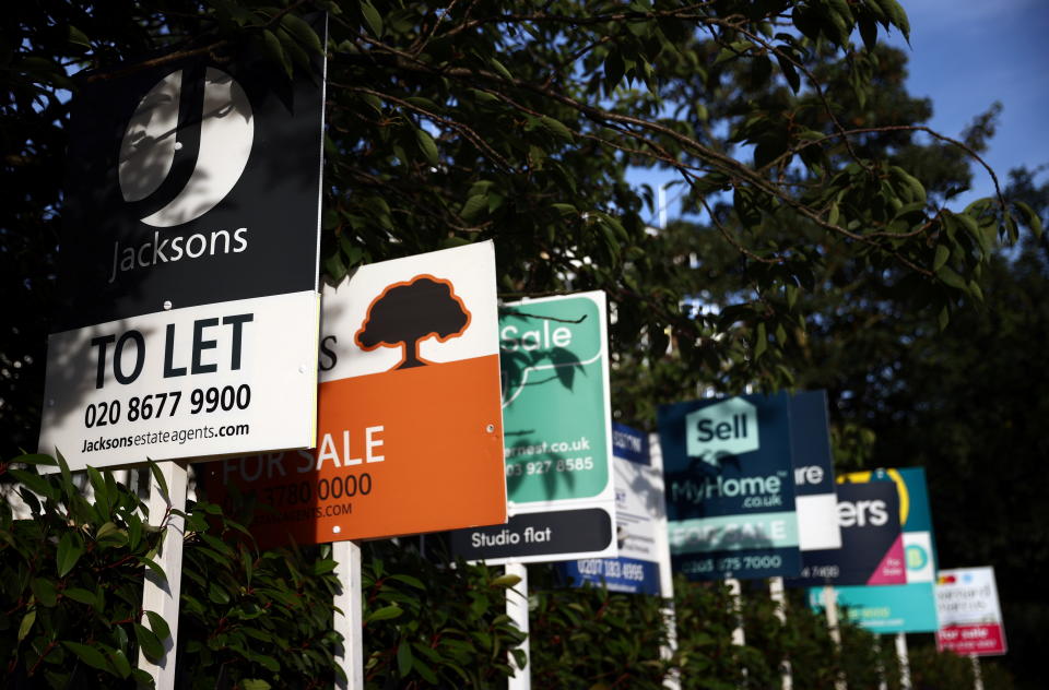 mortgage Property estate agent sales and letting signs are seen attached to railings outside an apartment building in south London, Britain, September 23, 2021. REUTERS/Hannah McKay