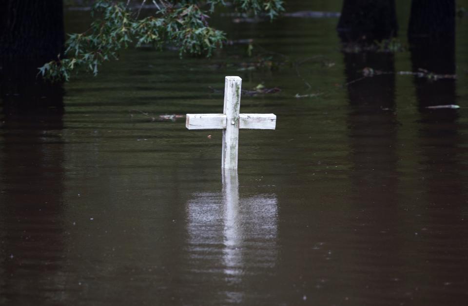 A cross is seen in flood water at a cemetery in Grifton, North Carolina.