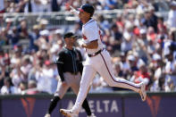 Atlanta Braves' Matt Olson gestures as he rounds the bases after hitting a home run in the second inning of a baseball game against the Arizona Diamondbacks Sunday, April 7, 2024, in Atlanta. (AP Photo/John Bazemore)