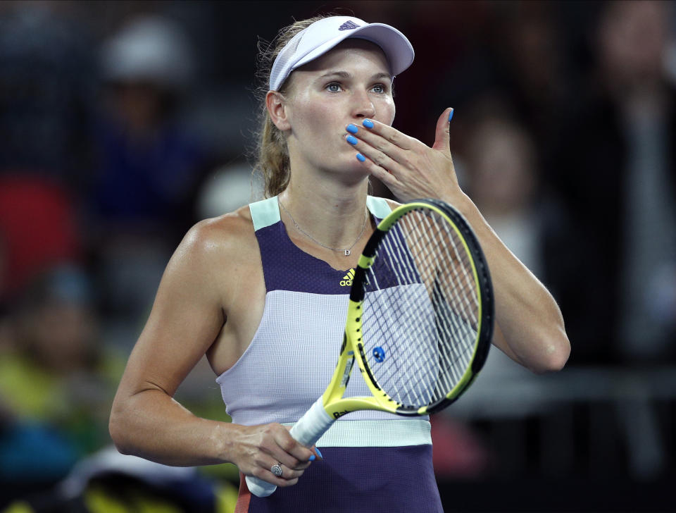 Denmark's Caroline Wozniacki reacts after defeating United States' Kristie Ahn in their first round singles match at the Australian Open tennis championship in Melbourne, Australia, Monday, Jan. 20, 2020. (AP Photo/Andy Wong)