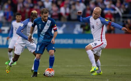 Guatemala midfielder Jean Marquez (8) dribbles the ball while United States midfielder Michael Bradley (4) defends in the first half of the game during the semifinal round of the 2018 FIFA World Cup qualifying soccer tournament at MAPFRE Stadium. Trevor Ruszkowski-USA TODAY Sports