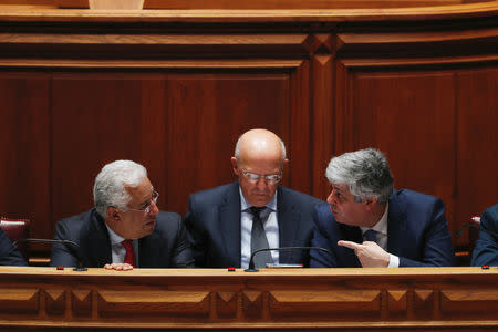 Portugal's Prime Minister Antonio Costa speaks with Finance Minister Mario Centeno during the debate of a motion of censure at the parliament in Lisbon, Portugal February 20, 2019. REUTERS/Rafael Marchante