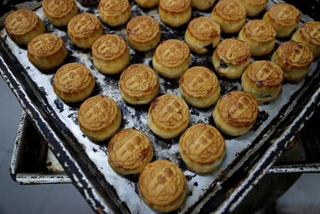 FILE PHOTO: Mooncakes with the Chinese words "Support each other" are seen at Wah Yee Tang Bakery in Hong Kong