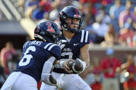 Mississippi quarterback Jaxson Dart (2) hands the ball off to running back Zach Evans (6) during the first half of an NCAA college football game against Tulsa in Oxford, Miss., Saturday, Sept. 24, 2022. (AP Photo/Thomas Graning)