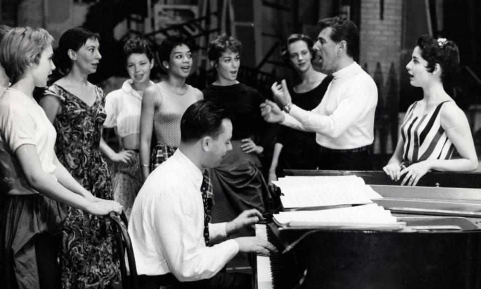 Stephen Sondheim at the piano and Leonard Bernstein rehearsing with Carol Lawrence, right, and the cast of West Side Story, 1957.