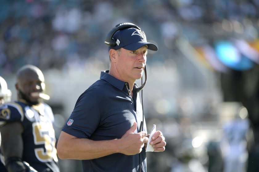 Los Angeles Rams offensive line coach Aaron Kromer works along the sideline during the first half of an NFL football game against the Jacksonville Jaguars Sunday, Oct. 15, 2017, in Jacksonville, Fla. (AP Photo/Phelan M. Ebenhack)