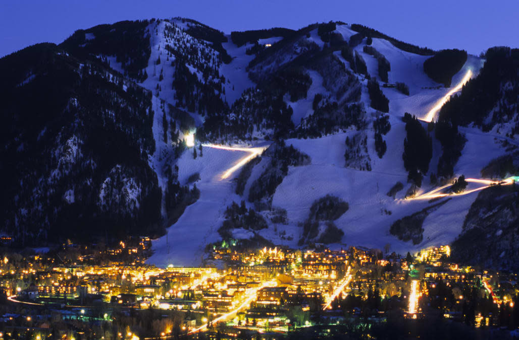 Ajax Mountain rises above the town of Aspen, Colorado at dusk.