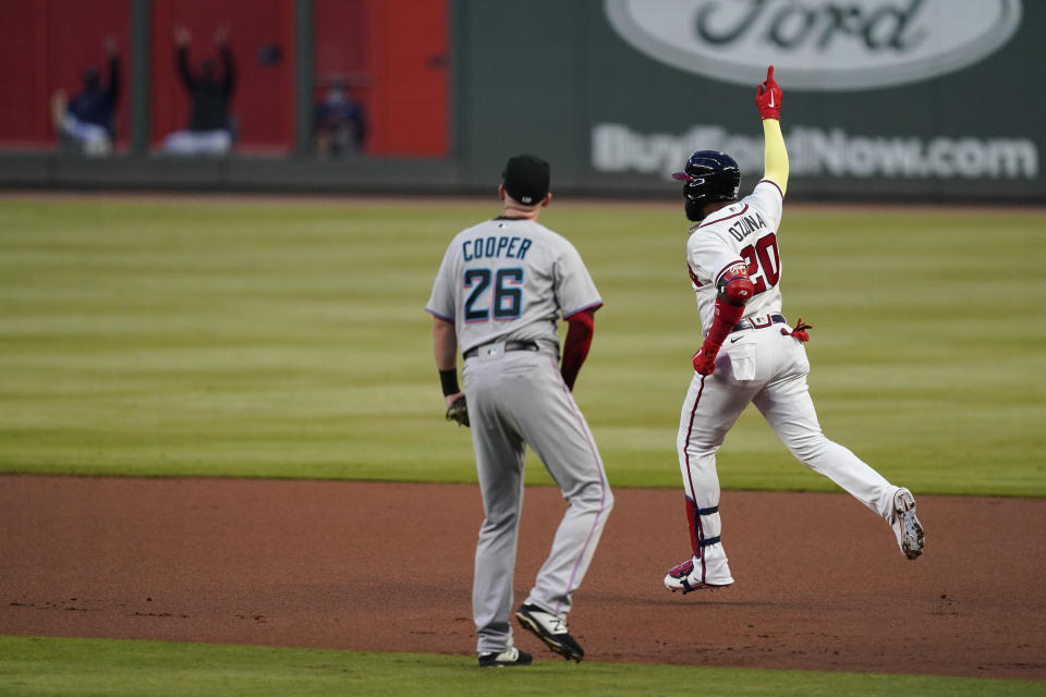 Atlanta Braves' Marcell Ozuna (20) celebrates after hitting a solo home run during the first inning of the team's baseball game against the Miami Marlins on Tuesday, Sept. 22, 2020, in Atlanta. (AP Photo/Brynn Anderson)