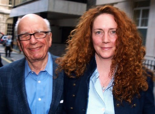 Rupert Murdoch (left), James Murdoch (not pictured) and Rebekah Brooks (right), who are all answering questions at parliament's Culture committee in London this afternoon