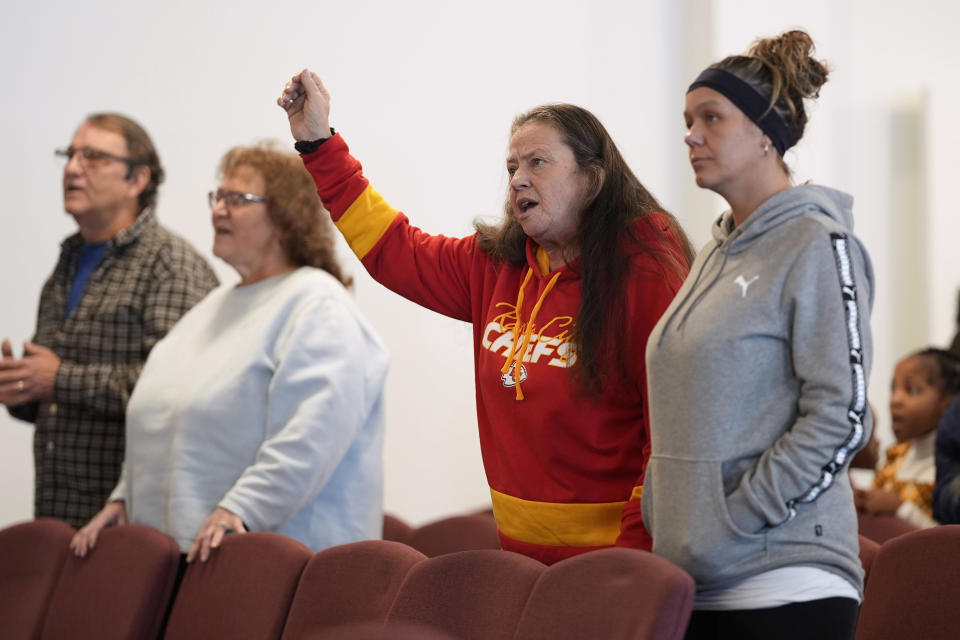 Ramona Brandt, of Des Moines, Iowa, second from right, prays during service at the First Church of God, Sunday, Jan. 7, 2024, in Des Moines, Iowa. Former President Donald Trump and his rivals for the GOP nomination have pushed for endorsements from pastors and faith communities. Evangelicals and religious Christian groups are traditionally critical to the Republican caucuses. (AP Photo/Charlie Neibergall)