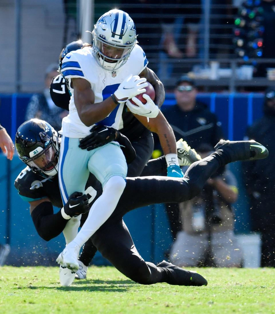 Jacksonville Jaguars safety Andre Cisco (5) makes the tackle on Dallas Cowboys wide receiver KaVontae Turpin (9) on a second quarter kick return. The Jacksonville Jaguars hosted the Dallas Cowboys at TIAA Bank Field Sunday, December 18, 2022. The Jaguars trailed 21 to 7 at the half. [Bob Self/Florida Times-Union]