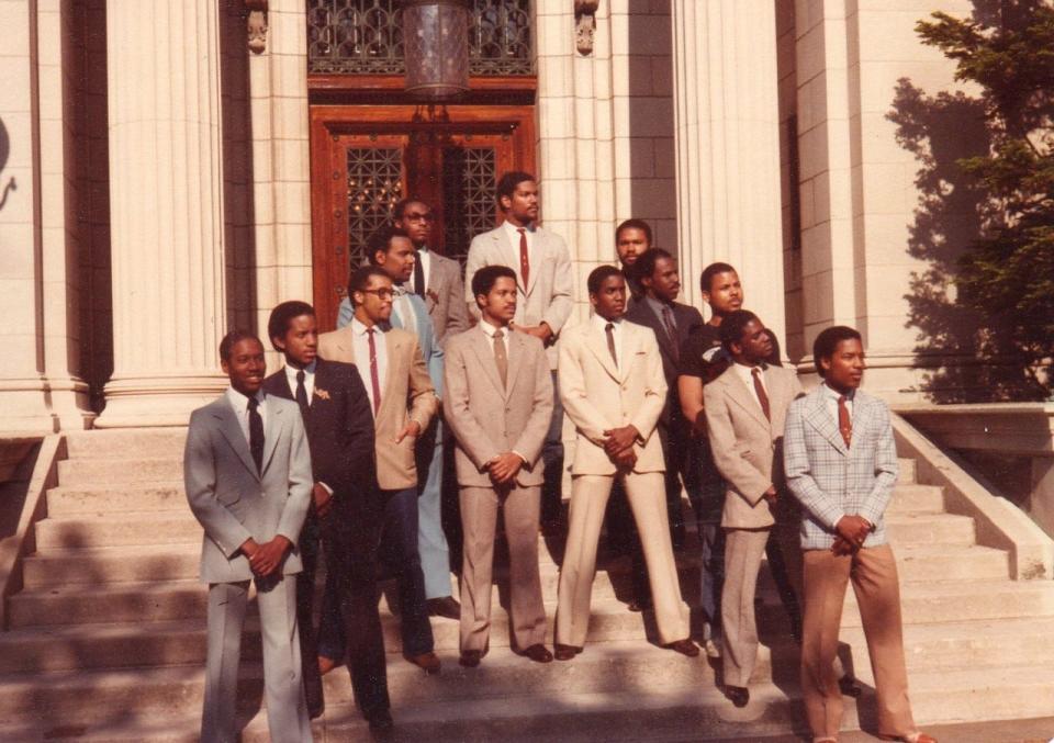 Alpha Gamma brothers in Brown University classes 1981 through 1983 stand for a photo on the steps of John Carter Brown Library.