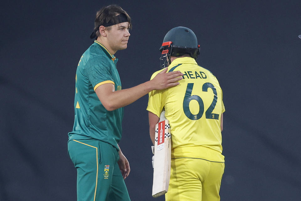 South Africa's Gerald Coetzee (L) pats Australia's Travis Head (C) on the back as Head leaves the field due to an injury during the fourth one-day international (ODI) cricket match between South Africa and Australia at SuperSport Park in Centurion on September 15, 2023. (Photo by PHILL MAGAKOE / AFP) (Photo by PHILL MAGAKOE/AFP via Getty Images)